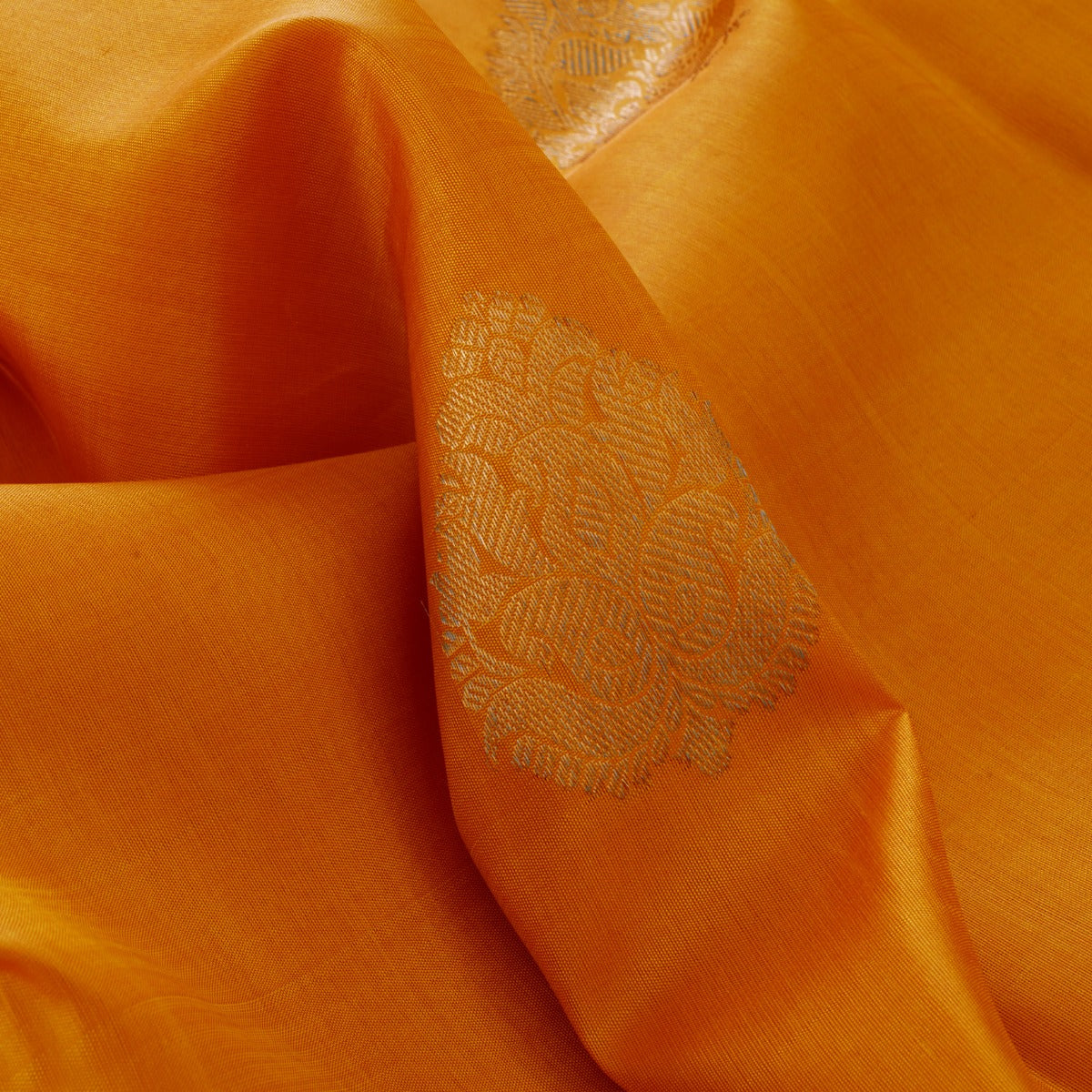 Mustard yellow with forest green blouse and zari motif kanchipuram silk saree