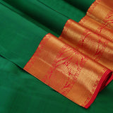 Forest green color with peacock zari motif and red blouse bridal silk saree